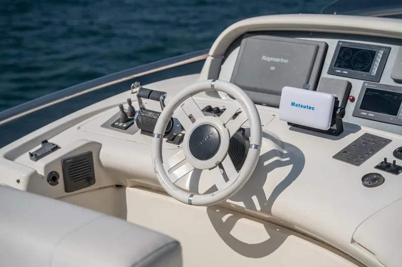 Richmind Yacht Photos Pics Steering console of 2007 Azimut 68E yacht with navigation equipment.