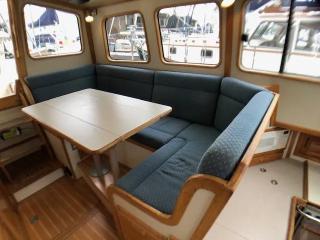  Yacht Photos Pics Salon table and settee - side view