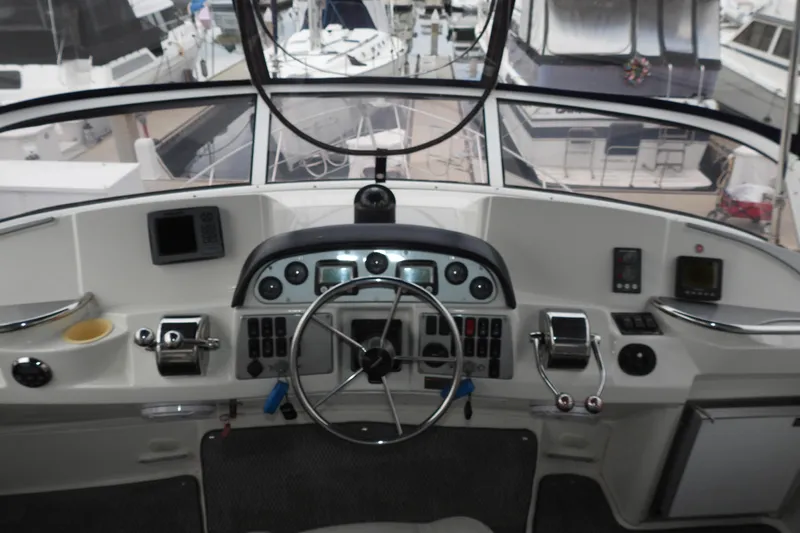  Yacht Photos Pics Cockpit of 2008 Carver 41 Cockpit Motor Yacht with steering wheel and control panel.