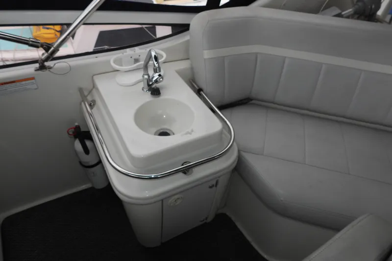  Yacht Photos Pics Interior of 2008 Carver 41 Cockpit Motor Yacht with sink and seating area.