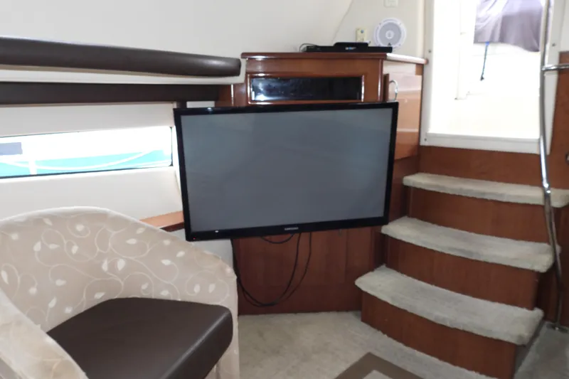  Yacht Photos Pics Interior of 2008 Carver 41 Cockpit Motor Yacht with TV and seating area.