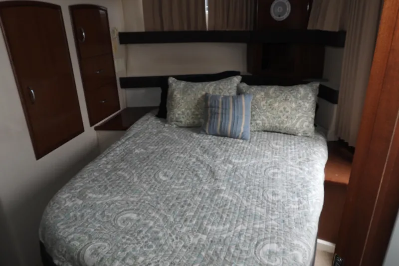  Yacht Photos Pics Interior cabin of 2008 Carver 41 Cockpit Motor Yacht with cozy bed and pillows.