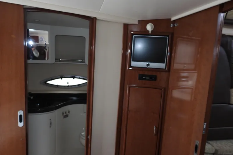  Yacht Photos Pics 2008 Carver 41 Cockpit Motor Yacht interior with TV and bathroom view.