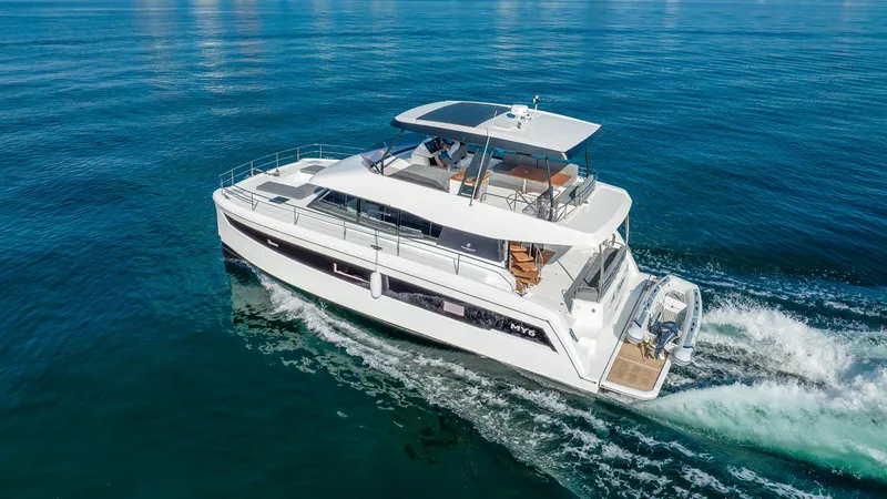 Au Natural Yacht Photos Pics 2023 Fountaine Pajot MY 6 yacht cruising on open water.