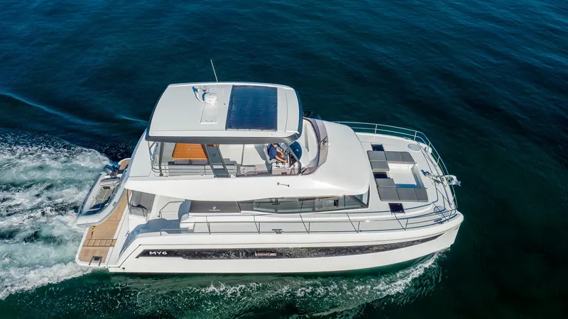 Au Natural Yacht Photos Pics 2023 Fountaine Pajot MY 6 yacht cruising on open water.