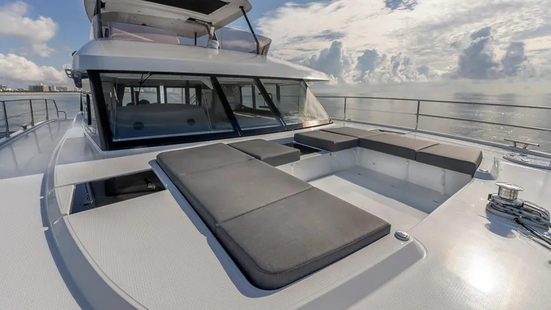 Au Natural Yacht Photos Pics 2023 Fountaine Pajot MY 6 yacht with spacious deck and luxurious seating.