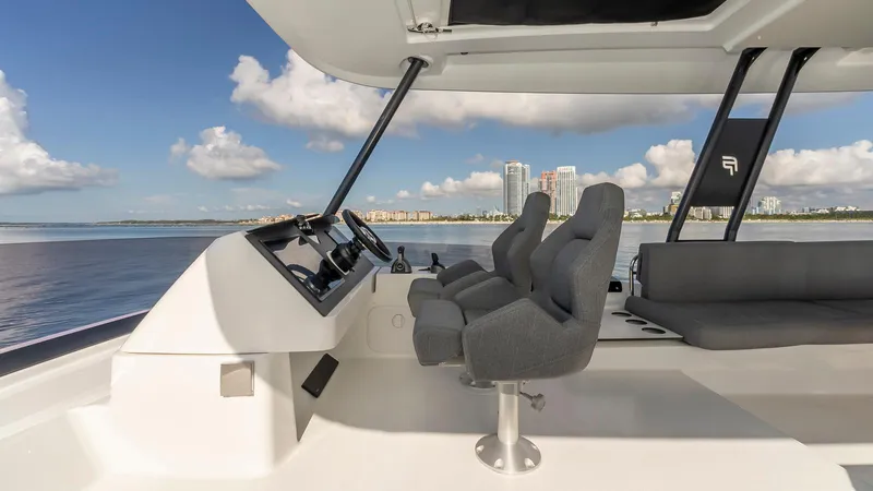 Au Natural Yacht Photos Pics 2023 Fountaine Pajot MY 6 yacht interior with modern seating and ocean view.
