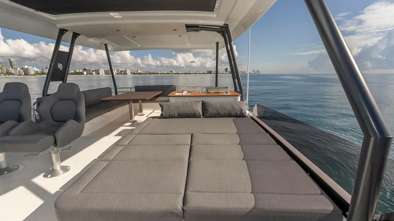 Au Natural Yacht Photos Pics Luxurious 2023 Fountaine Pajot MY 6 yacht interior with ocean view and modern seating.