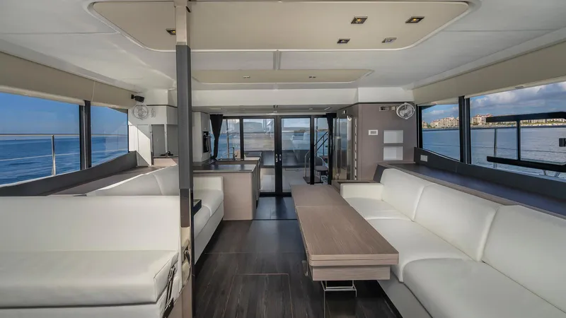 Au Natural Yacht Photos Pics Luxurious interior of 2023 Fountaine Pajot MY 6 yacht with ocean view.