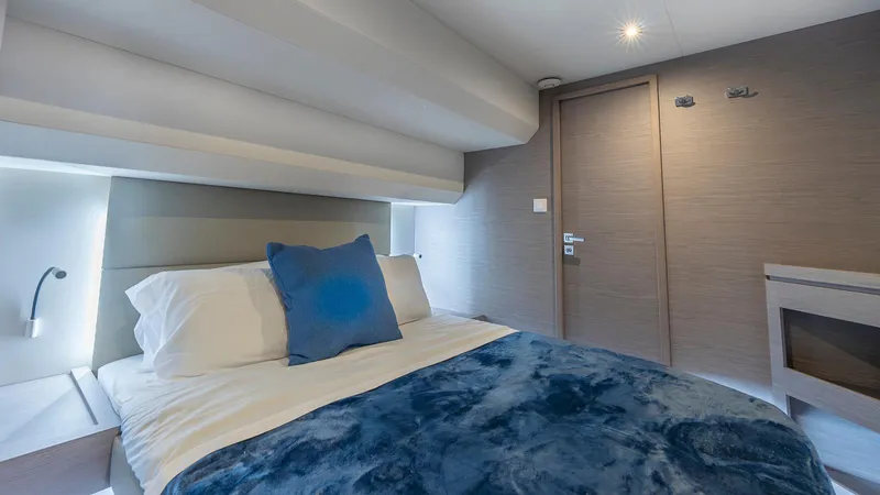 Au Natural Yacht Photos Pics Luxurious bedroom interior of 2023 Fountaine Pajot MY 6 yacht with modern design.
