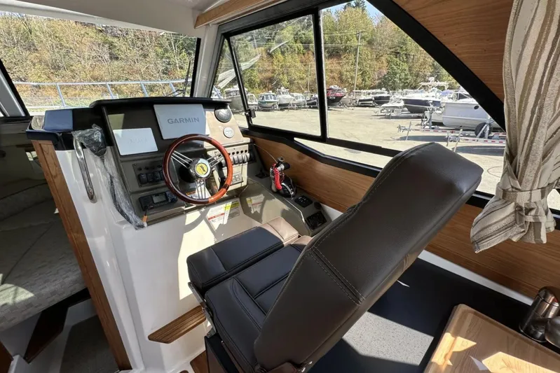  Yacht Photos Pics Interior of 2026 Cutwater C-248 Coupe boat with Garmin navigation system and leather seating.