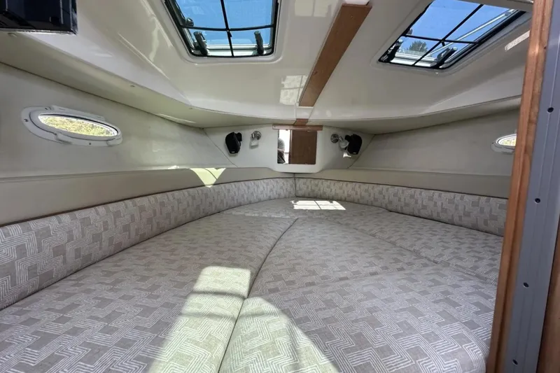  Yacht Photos Pics 2026 Cutwater C-248 Coupe interior cabin with patterned upholstery and skylights.