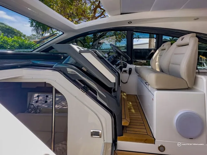  Yacht Photos Pics 2023 Fairline Targa 45 Open yacht cockpit with luxurious seating and modern controls.