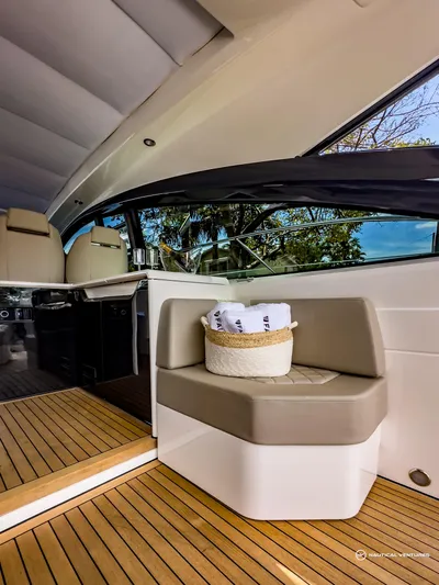  Yacht Photos Pics 2023 Fairline Targa 45 Open interior with seating and wooden flooring.