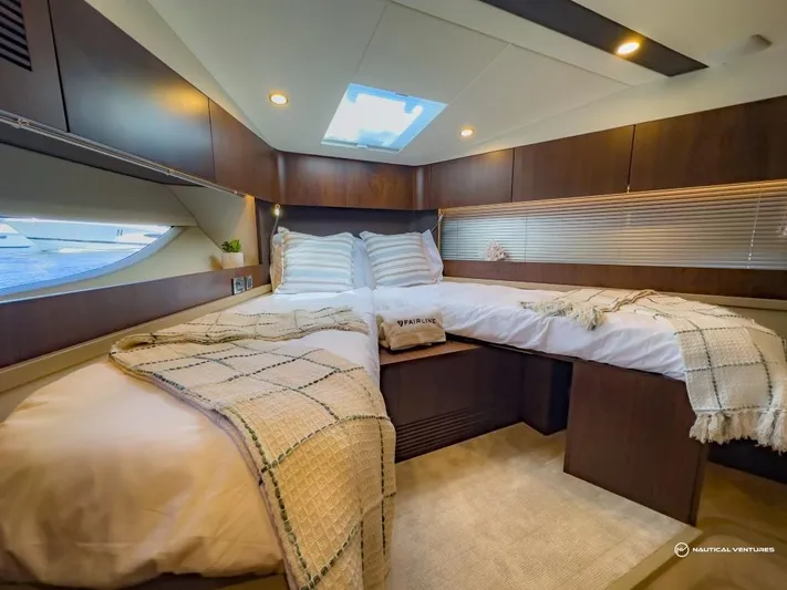  Yacht Photos Pics Luxurious bedroom in 2023 Fairline Targa 45 Open yacht with skylight and modern decor.