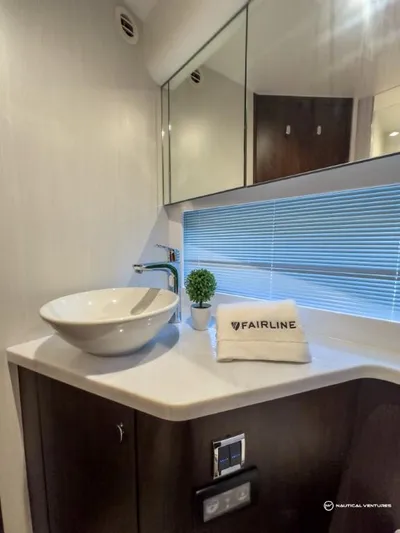  Yacht Photos Pics Modern bathroom in 2023 Fairline Targa 45 Open yacht with sleek sink and mirror.