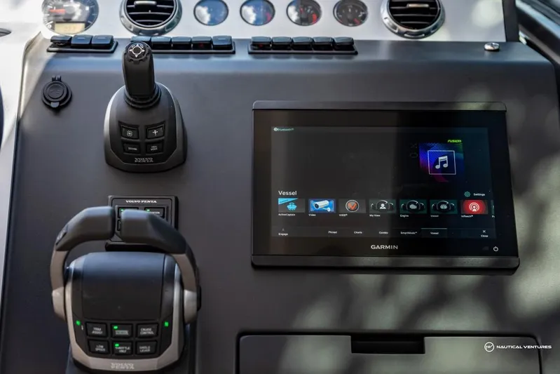  Yacht Photos Pics Control panel of 2023 Fairline Targa 45 Open yacht with Garmin touchscreen and joystick.