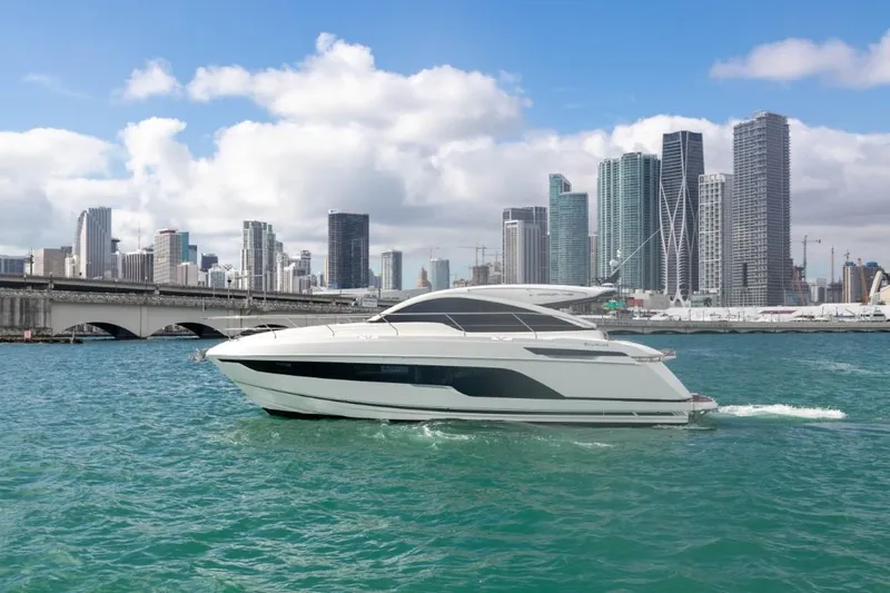  Yacht Photos Pics Fairline Targa 45 Open 2023 yacht cruising near city skyline.