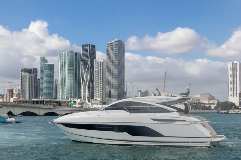  Yacht Photos Pics 2023 Fairline Targa 45 Open yacht cruising near city skyline.