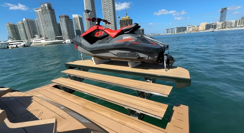 Eva Yacht Photos Pics Jet ski on Van der Valk Waterdream California 52 yacht platform, city skyline in background.