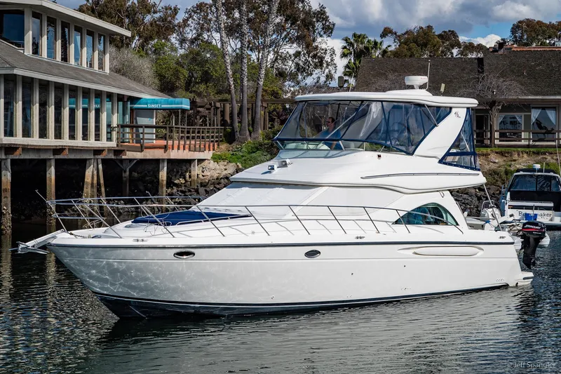 Sea Horse Yacht Photos Pics 2002 Maxum 4600 SCB Limited Edition yacht docked near waterfront buildings.