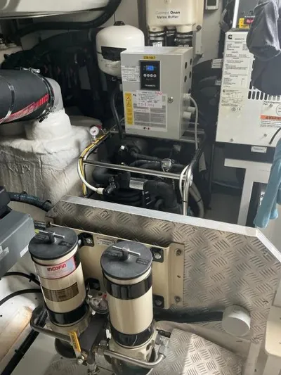 Asia 3 Yacht Photos Pics Engine room of 2019 Azimut 60 yacht with mechanical equipment and filters.