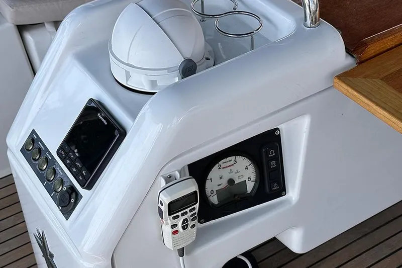 Nautical Dreamer Yacht Photos Pics Control panel of 2019 Jeanneau Sun Odyssey 490 sailboat with navigation instruments.