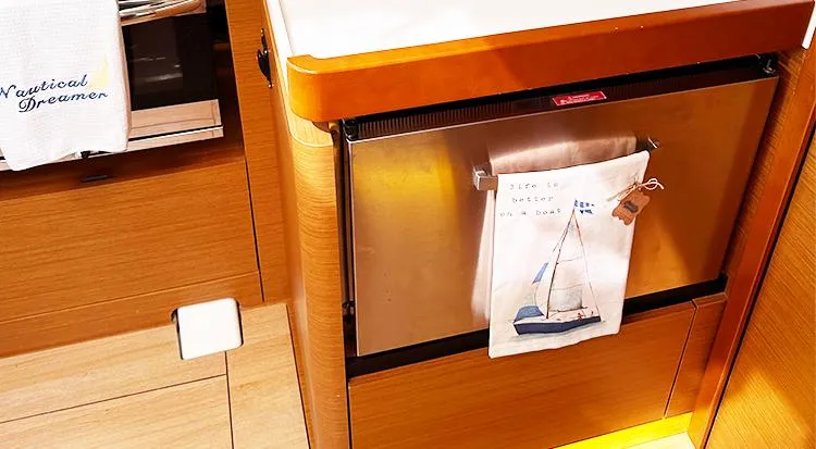 Nautical Dreamer Yacht Photos Pics Interior of 2019 Jeanneau Sun Odyssey 490 yacht kitchen with nautical-themed decor.