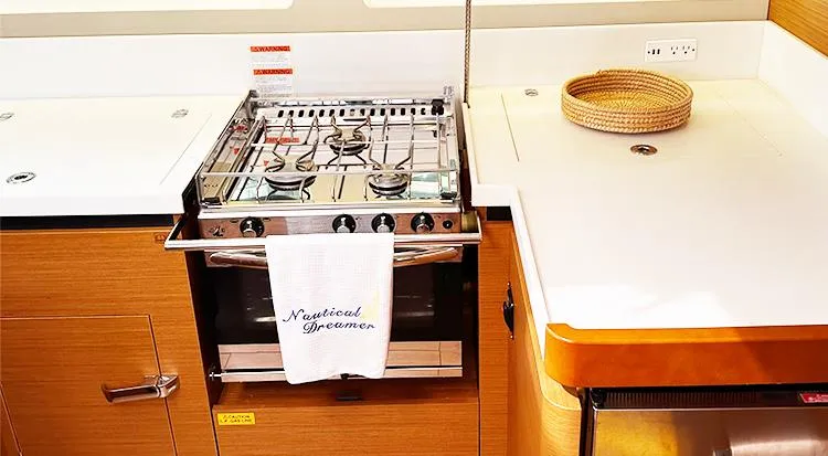 Nautical Dreamer Yacht Photos Pics Modern kitchen in 2019 Jeanneau Sun Odyssey 490 yacht with stove and countertop.