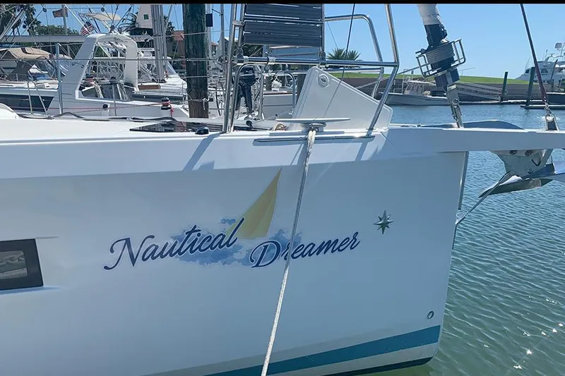 Nautical Dreamer Yacht Photos Pics Jeanneau Sun Odyssey 490 sailboat named "Nautical Dreamer" docked in a marina, 2019 model.