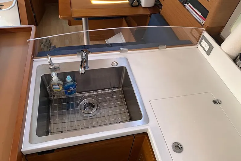 Nautical Dreamer Yacht Photos Pics Modern kitchen sink in 2019 Jeanneau Sun Odyssey 490 yacht, featuring sleek design and functionality.