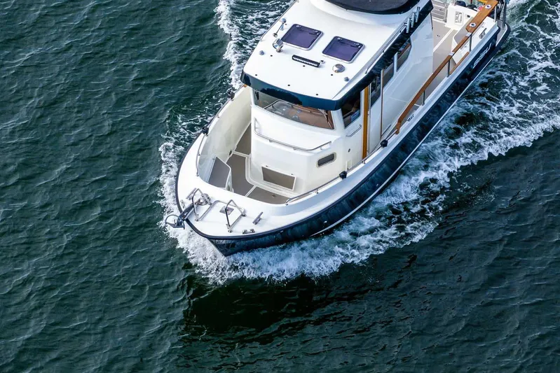  Yacht Photos Pics 2019 Targa 27.2 boat cruising on open water, aerial view.
