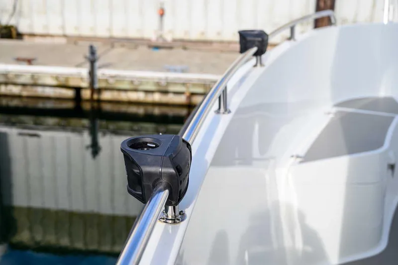  Yacht Photos Pics 2019 Targa 27.2 boat railing with mounted accessories at a dock.