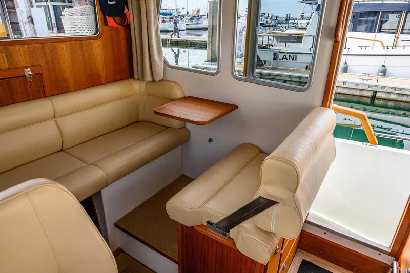  Yacht Photos Pics Interior of 2019 Targa 27.2 boat with beige seating and wooden accents.