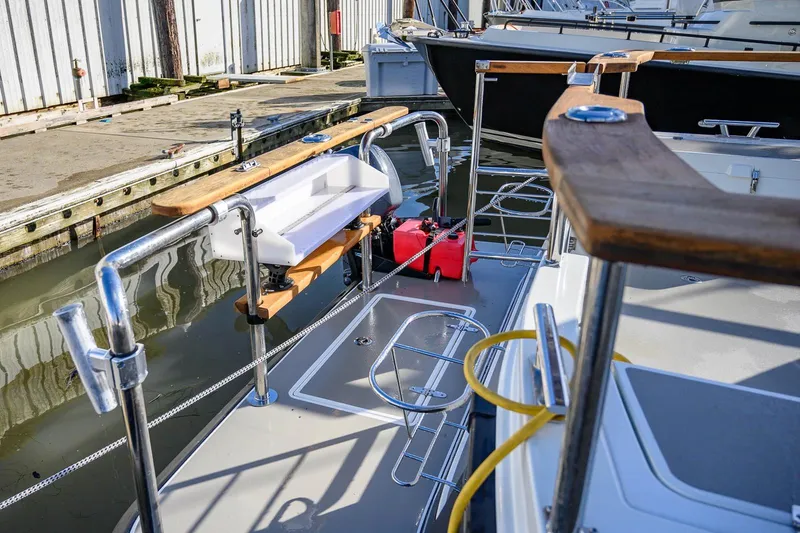  Yacht Photos Pics 2019 Targa 27.2 boat docked, featuring stainless steel railings and wooden accents.