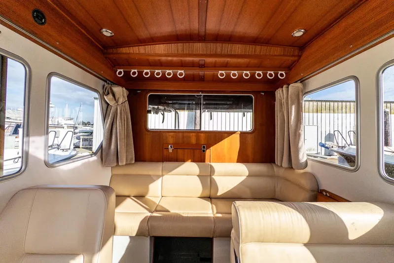  Yacht Photos Pics Interior of 2019 Targa 27.2 boat with beige seating and wooden accents.