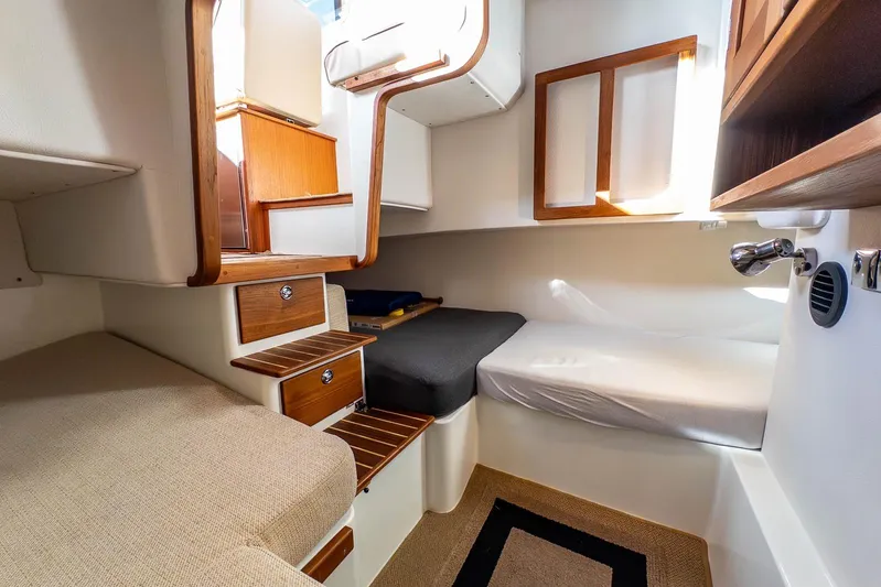  Yacht Photos Pics 2019 Targa 27.2 cabin interior with wooden accents and cozy seating.