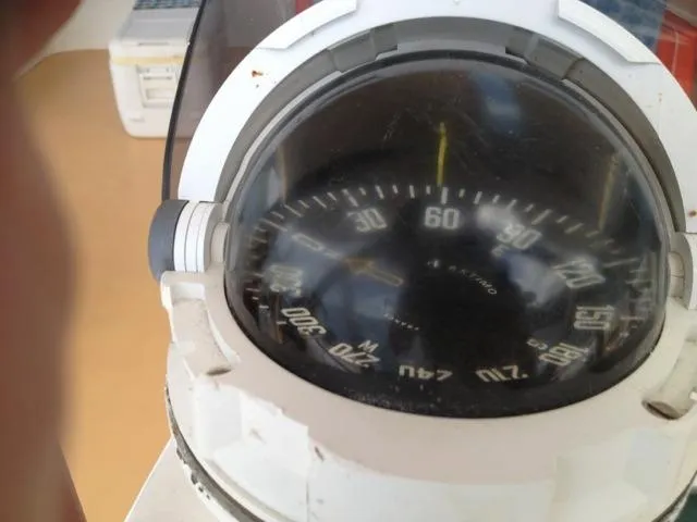 Sun Cat Yacht Photos Pics Close-up of a compass on a 2011 Custom Sunrise 59 Day Charter boat.