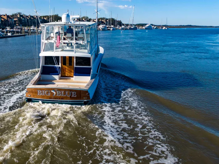  Yacht Photos Pics Custom Carolina 66 yacht from 2005 cruising in a marina.