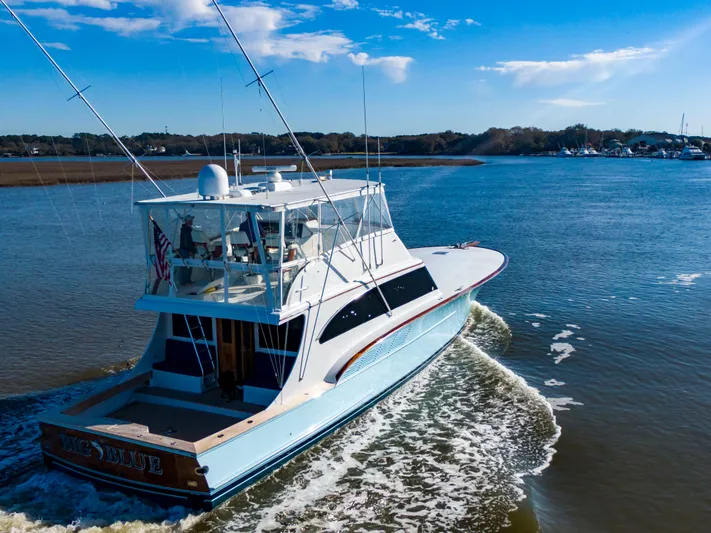  Yacht Photos Pics Custom Carolina 66 yacht cruising on a sunny day, 2005 model.