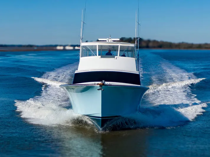  Yacht Photos Pics 2005 Custom Carolina 66 yacht cruising on open water.