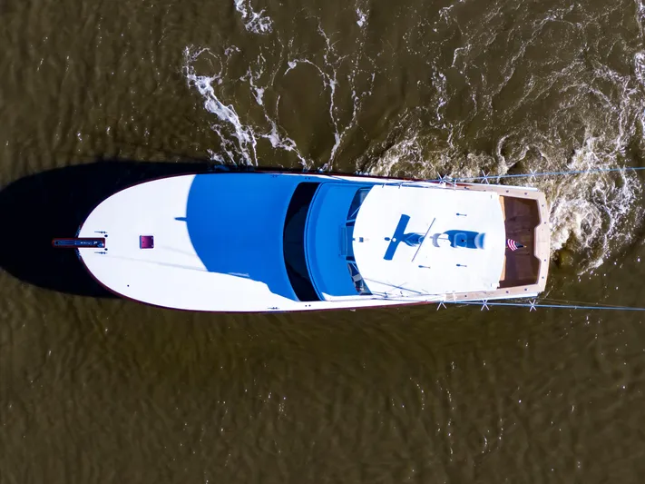  Yacht Photos Pics Aerial view of 2005 Custom Carolina 66 yacht cruising on water.