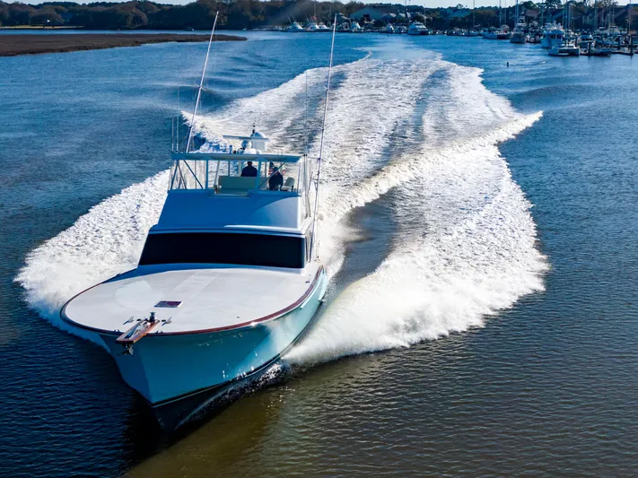  Yacht Photos Pics Custom Carolina 66 yacht cruising on a sunny day, 2005 model.