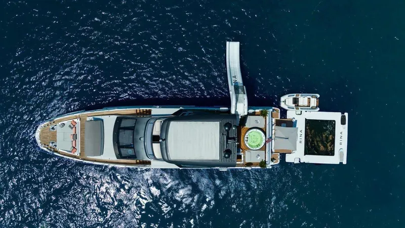 Enchante Yacht Photos Pics Azimut Grande 27 METRI yacht, aerial view, 2020 model, on blue ocean water.