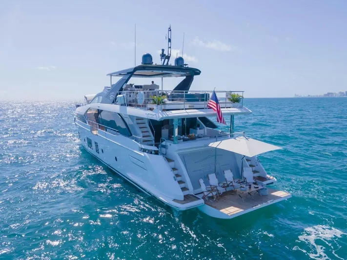 Enchante Yacht Photos Pics Luxurious 2020 Azimut Grande 27 METRI yacht cruising on open sea.