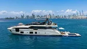 Enchante Yacht Photos Pics Luxury Azimut Grande 27 METRI yacht cruising near city skyline, 2020 model.