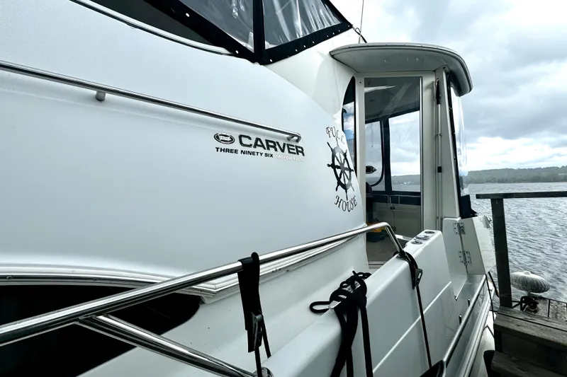 Yacht Photos Pics 2003 Carver 396 Motor Yacht docked, featuring sleek design and "Full House" emblem.