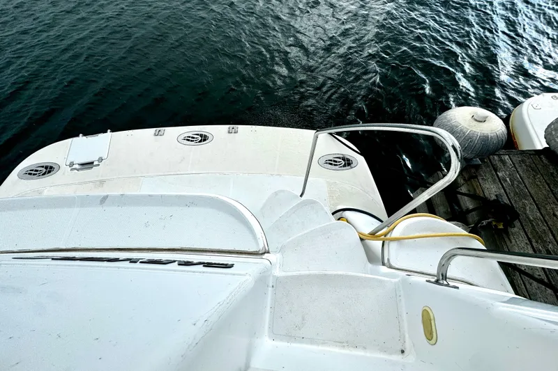  Yacht Photos Pics 2003 Carver 396 Motor Yacht docked, view of stern and water.