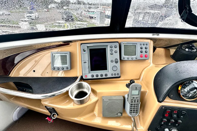 Yacht Photos Pics 2003 Carver 396 Motor Yacht helm with navigation instruments and communication devices.