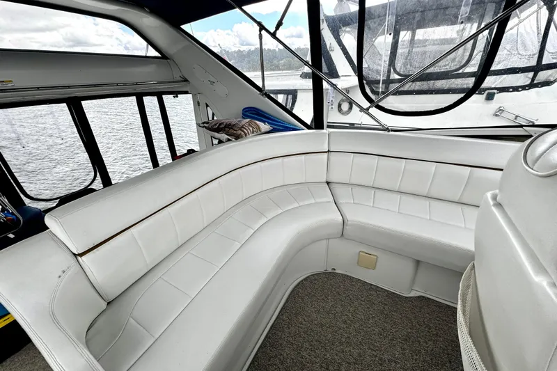  Yacht Photos Pics Luxurious seating area on a 2003 Carver 396 Motor Yacht with white upholstery.